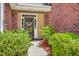 Inviting front door of a charming brick home with well-manicured landscaping at 405 Decatur Dr, Summerville, SC 29486