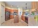 Bright kitchen features stainless steel appliances, center island, and granite countertops at 405 Decatur Dr, Summerville, SC 29486