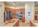 Stylish kitchen boasts stainless appliances, tile backsplash, and granite countertops at 405 Decatur Dr, Summerville, SC 29486