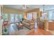 Open-concept living room with French doors leading to the backyard and adjacent kitchen area at 405 Decatur Dr, Summerville, SC 29486