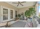 Covered back porch showcasing multiple chairs and decor with natural light from the backyard at 405 Decatur Dr, Summerville, SC 29486
