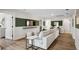 Open basement area with a white sofa, television, and access to a bathroom and other rooms at 406 Cadbury Loop, Summerville, SC 29486