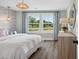 Bedroom featuring hardwood floors, large windows, and a light-filled aesthetic at 406 Cadbury Loop, Summerville, SC 29486