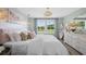 Bright bedroom with natural light, stylish decor, and a surfboard accent at 406 Cadbury Loop, Summerville, SC 29486