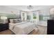Bedroom highlighting natural light, golf decor, and modern lighting at 406 Cadbury Loop, Summerville, SC 29486
