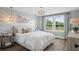 Bedroom boasts natural light, coastal decor, and decorative lighting fixtures at 406 Cadbury Loop, Summerville, SC 29486