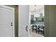 Home office with desk, chairs, and shelving, featuring shiplap walls and ample natural light at 406 Cadbury Loop, Summerville, SC 29486