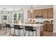 Modern kitchen featuring an island with bar seating, pendant lighting, and wood floors at 406 Cadbury Loop, Summerville, SC 29486