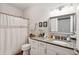 Well-lit bathroom featuring granite counters, white cabinets, and shower-tub combination at 45 Sycamore Ave # 811, Charleston, SC 29407