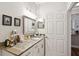 Bright bathroom featuring granite counters, stylish fixtures, and a large mirror at 45 Sycamore Ave # 811, Charleston, SC 29407