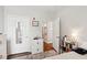 Clean bedroom featuring wood floors, mirrored door, and view to kitchen at 45 Sycamore Ave # 811, Charleston, SC 29407