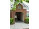 Brick archway entrance with unit number signage and staircase access at 45 Sycamore Ave # 811, Charleston, SC 29407