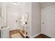 Welcoming foyer with wood floors and a console table and decorative mirror at 45 Sycamore Ave # 811, Charleston, SC 29407