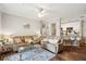 Open-concept living room with a comfortable sofa, bar seating, and a view into the kitchen at 45 Sycamore Ave # 811, Charleston, SC 29407
