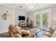 Comfortable living room boasting a large sectional sofa, a modern media center and bright, natural light at 45 Sycamore Ave # 811, Charleston, SC 29407