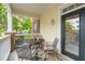 Inviting covered porch with comfortable seating and a view of the community's lush greenery at 45 Sycamore Ave # 811, Charleston, SC 29407