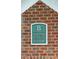 Close-up of brick wall with unit numbers sign for the building's residences at 45 Sycamore Ave # 811, Charleston, SC 29407