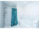 Bathroom featuring a combined shower and soaking tub with tiled walls and a blue floral curtain at 4515 Holmes Ave, North Charleston, SC 29405