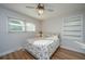 Cozy bedroom featuring hardwood floors, a ceiling fan, and a comfortable floral bedspread at 4515 Holmes Ave, North Charleston, SC 29405