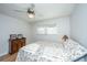 Inviting bedroom featuring hardwood floors, a ceiling fan, and a comfortable floral bedspread at 4515 Holmes Ave, North Charleston, SC 29405