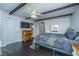 Comfortable bedroom featuring dark wood floors, ceiling beams, and elegant furniture at 4515 Holmes Ave, North Charleston, SC 29405