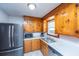 Functional kitchen with stainless steel appliances, wooden cabinets, and ample counter space at 4515 Holmes Ave, North Charleston, SC 29405