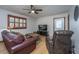 Comfortable living room with hardwood floors, ceiling fan, and plush leather seating at 4515 Holmes Ave, North Charleston, SC 29405