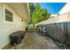 Outdoor patio area with a grill, dining table, and chairs, perfect for entertaining and relaxing at 4515 Holmes Ave, North Charleston, SC 29405