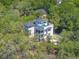 An impressive aerial view of the house surrounded by trees, highlighting its unique architecture at 4637 Bonnie Marie Way, North Charleston, SC 29405