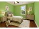 bedroom featuring a comfortable bed, hardwood floors, and playful décor at 4637 Bonnie Marie Way, North Charleston, SC 29405