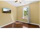 Cozy bedroom featuring hardwood floors, neutral paint, and a window with natural light at 4637 Bonnie Marie Way, North Charleston, SC 29405