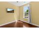 Cozy bedroom featuring hardwood floors, neutral paint, and a window with natural light at 4637 Bonnie Marie Way, North Charleston, SC 29405