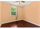 Bedroom with hardwood floors, large windows, and neutral walls at 4637 Bonnie Marie Way, North Charleston, SC 29405