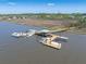 Another aerial photo of a private boat dock and waterway showcasing boat slips, and covered seating area at 4637 Bonnie Marie Way, North Charleston, SC 29405