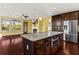 Eat-in kitchen featuring granite countertops, stainless steel appliances, a large island, and hardwood floors at 4637 Bonnie Marie Way, North Charleston, SC 29405
