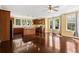 Bright kitchen with hardwood floors, wooden cabinetry, and ample natural light from multiple windows at 4637 Bonnie Marie Way, North Charleston, SC 29405