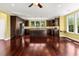 Spacious kitchen with dark wood cabinets, stainless steel appliances, and an island at 4637 Bonnie Marie Way, North Charleston, SC 29405