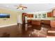 Open-concept living space with hardwood floors, a kitchen, and natural light at 4637 Bonnie Marie Way, North Charleston, SC 29405