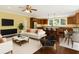 Open-concept living space with hardwood floors, a kitchen, and comfortable seating at 4637 Bonnie Marie Way, North Charleston, SC 29405