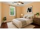 Bedroom featuring a bed with a padded headboard, a neutral color palette, and hardwood floors at 4637 Bonnie Marie Way, North Charleston, SC 29405