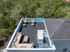 A rooftop deck with an outdoor kitchen, a sectional sofa, chairs and tables perfect for entertaining and relaxing at 4637 Bonnie Marie Way, North Charleston, SC 29405