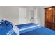 Bedroom features a closet access, along with bed with blue accents and dark wood furnishings at 4856 Carnoustie Ct, Summerville, SC 29485