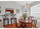 Cozy dining area featuring a wooden table, chairs, and pendant lighting at 4856 Carnoustie Ct, Summerville, SC 29485