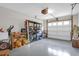 Spacious garage is designed for storage, complete with shelves and room for activities at 4856 Carnoustie Ct, Summerville, SC 29485