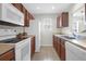Functional kitchen with white appliances, wood cabinets, and ample counter space at 4856 Carnoustie Ct, Summerville, SC 29485