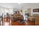 Bright and airy living room featuring hardwood floors and comfortable seating at 4856 Carnoustie Ct, Summerville, SC 29485