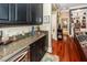 Stylish bar area with a sink, wine fridge, and granite countertop, great for entertaining at 4991 Sound View Dr, Mount Pleasant, SC 29466