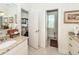 Well-lit bathroom with granite countertop vanity and open doorway leading to the commode at 4991 Sound View Dr, Mount Pleasant, SC 29466