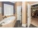 Bathroom featuring a soaking tub with tile surround at 4991 Sound View Dr, Mount Pleasant, SC 29466