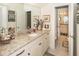 Well-lit bathroom showcasing granite counters with doorways to other bathrooms at 4991 Sound View Dr, Mount Pleasant, SC 29466